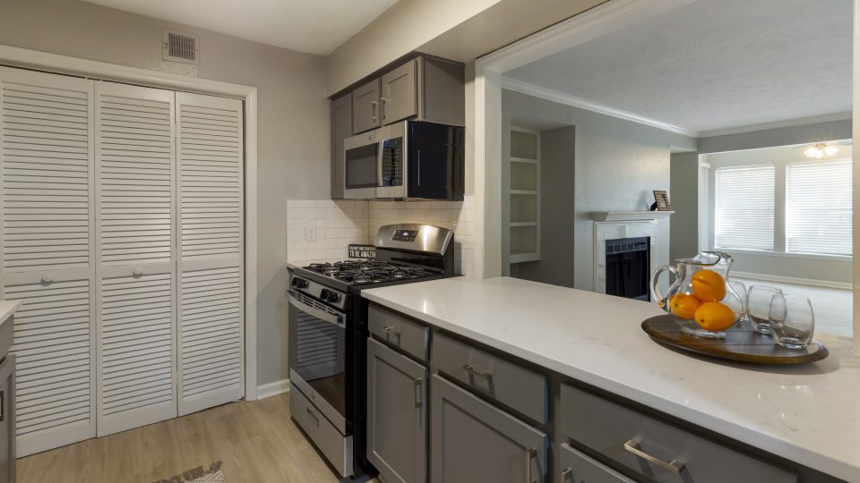 kitchen with stainless steel appliances and granite countertops at The  Hargrove at Southpoint